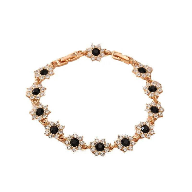 Women's zinc alloy bracelet with flower design and electroplated finish in gold and silver colour options