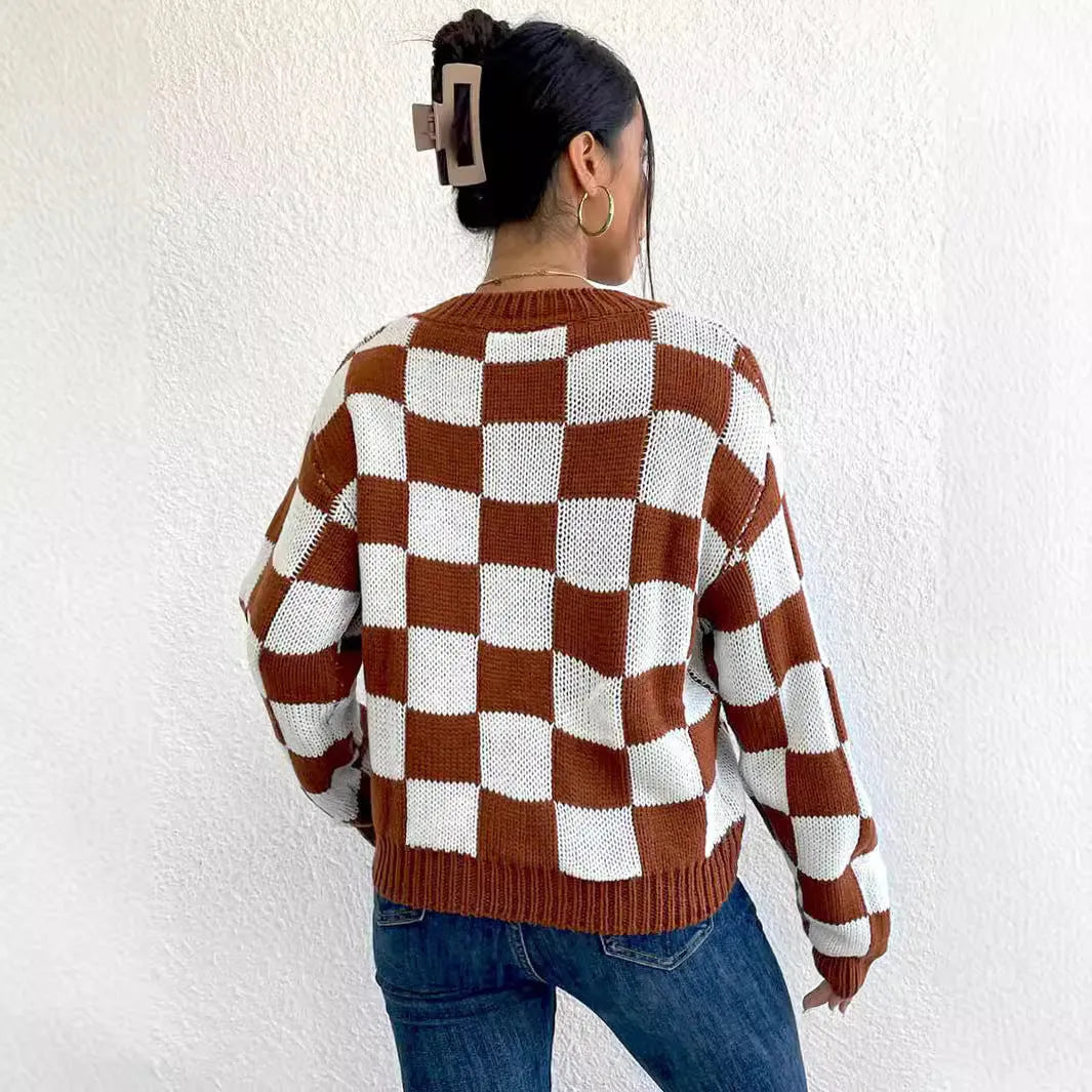 Dark brown plaid pattern on a loose-fitting acrylic pullover sweater with long sleeves