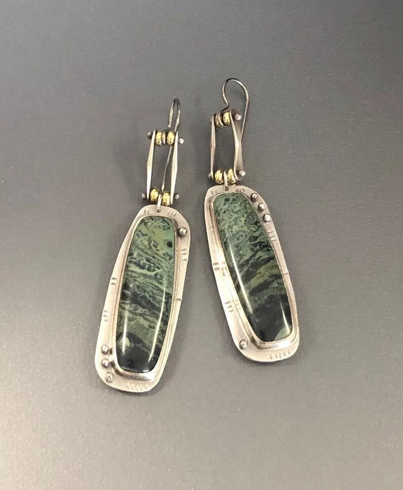Geometric drop earrings with a two-tone marble pattern finish, made from silver-toned alloy.