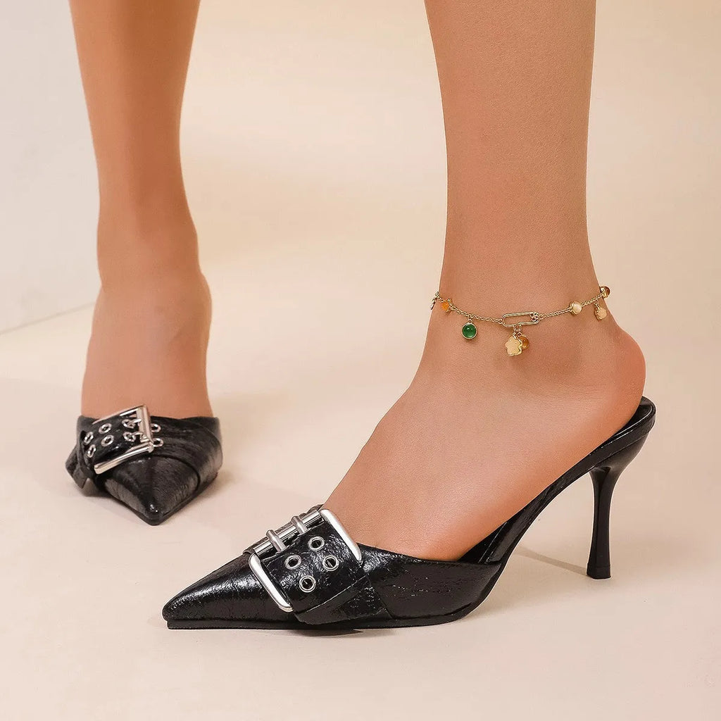 Black women's pointed high heels with metal buckle decoration on thin ankle strap