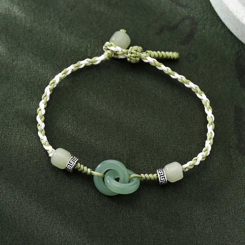 Women's ethnic style copper bracelet with peace buckle and double ring design in green.