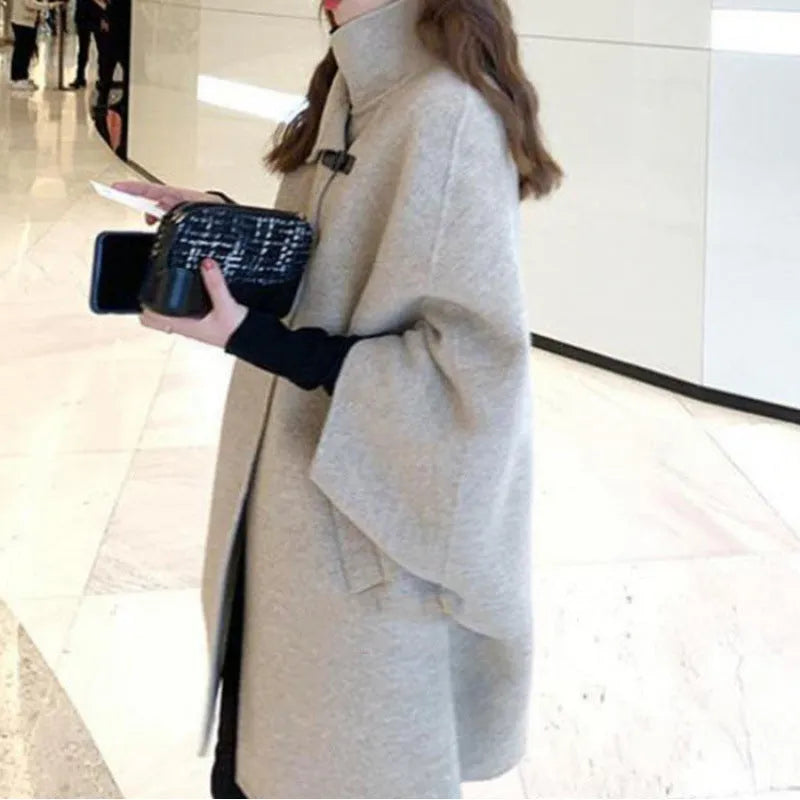 Women's Korean style coat with flight sleeves and half sleeve length in oatmeal colour