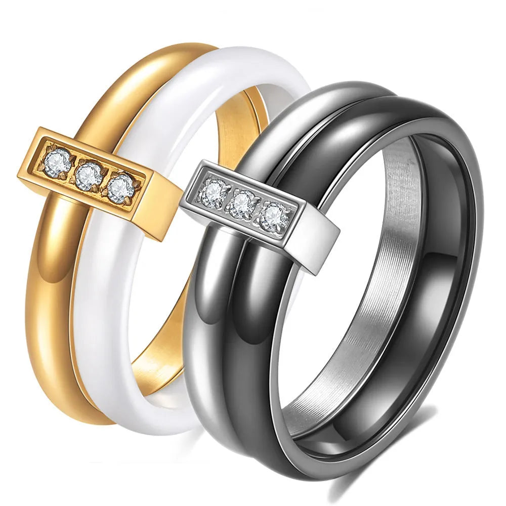 Glossy black ceramic women's ring with round zirconium stones on a geometric 6mm band.