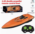 Simulation electric remote-control ship toy double paddle high-speed boat in orange colour on water
