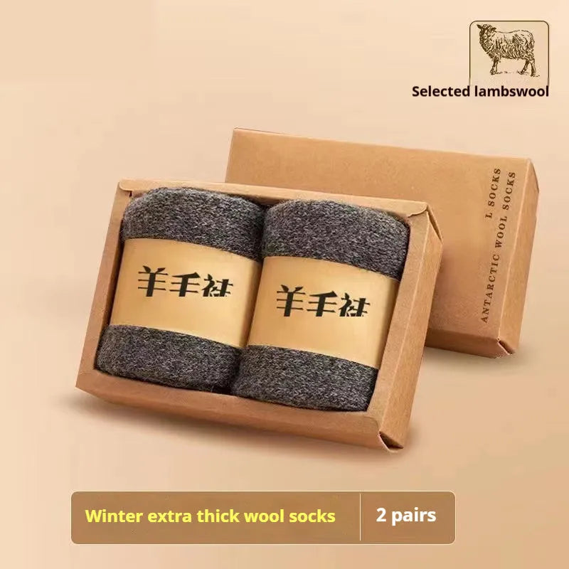 Pair of thick wool socks with a merino wool midsole in a cold-resistant dark grey colour.