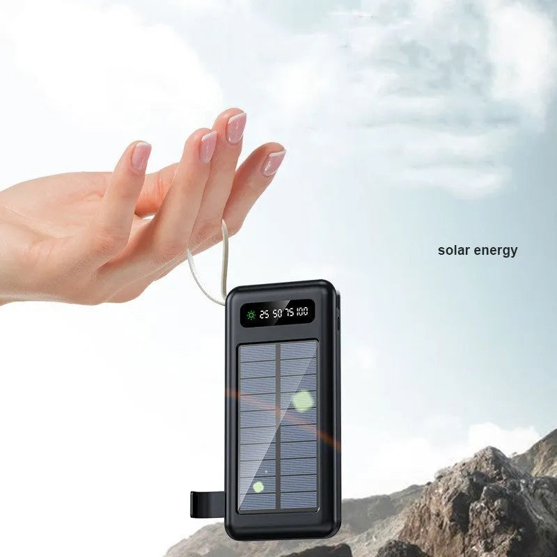 Black or white solar power bank showing the solar panel and USB ports, with a multi-purpose charging cable.