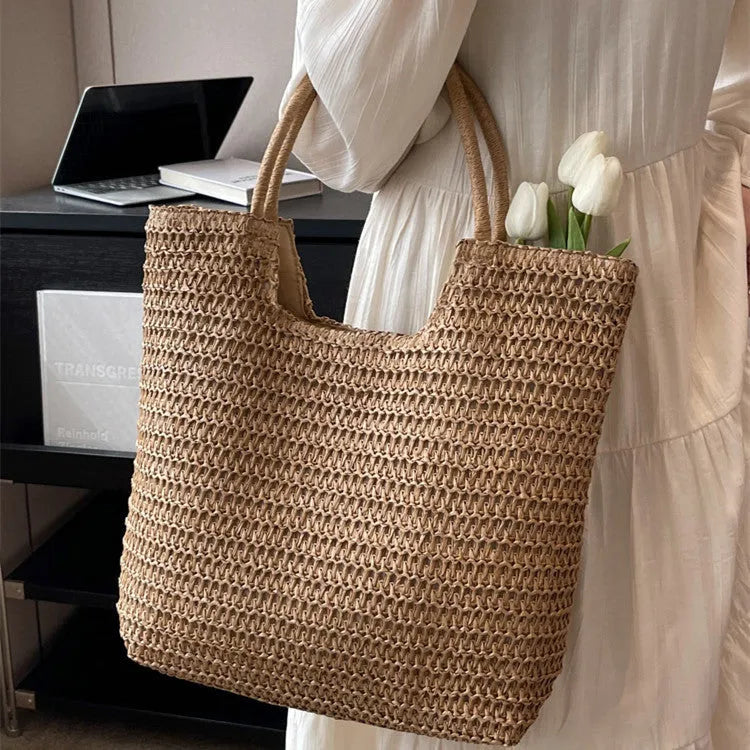 Women's large capacity straw bag in beige with canvas lining and double shoulder straps