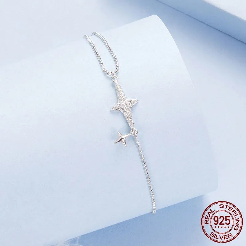 S925 sterling silver white gold plated star charm bracelet on a white background for women