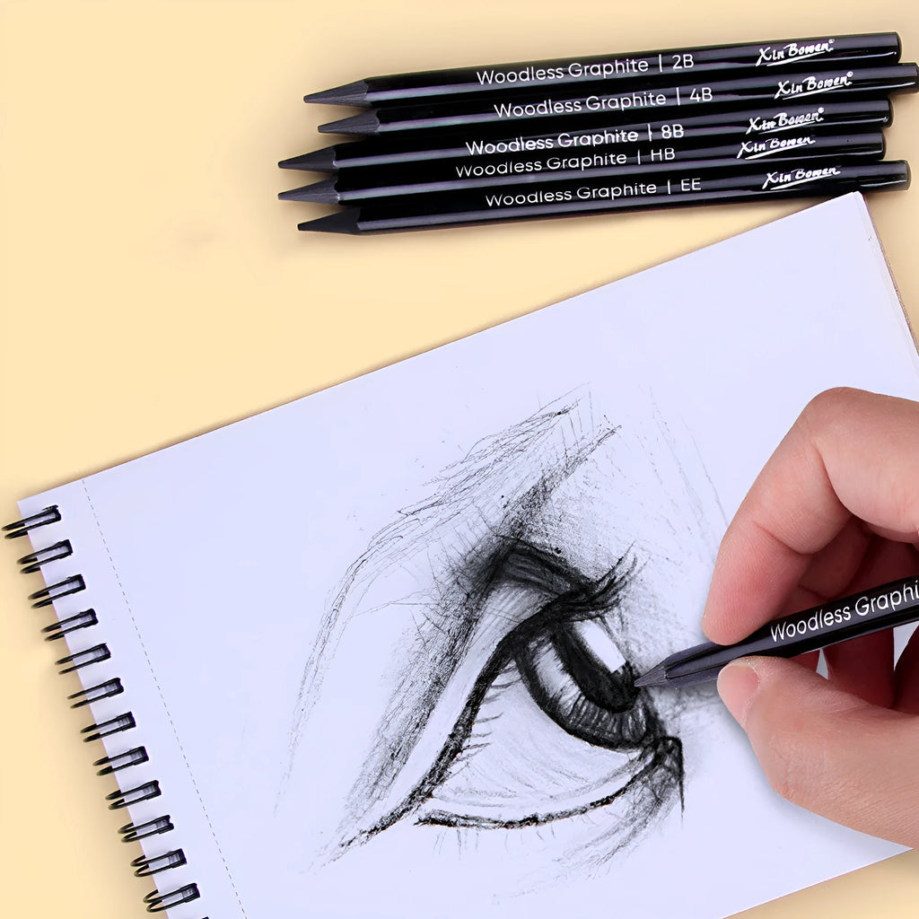 Six wood-free graphite sketching pencils showing different hardness grades HB 2B 4B 6B 8B EE