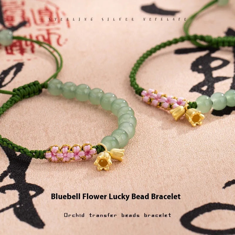 Red rope hand woven women's bracelet with floral decorative elements in BZ479 colour