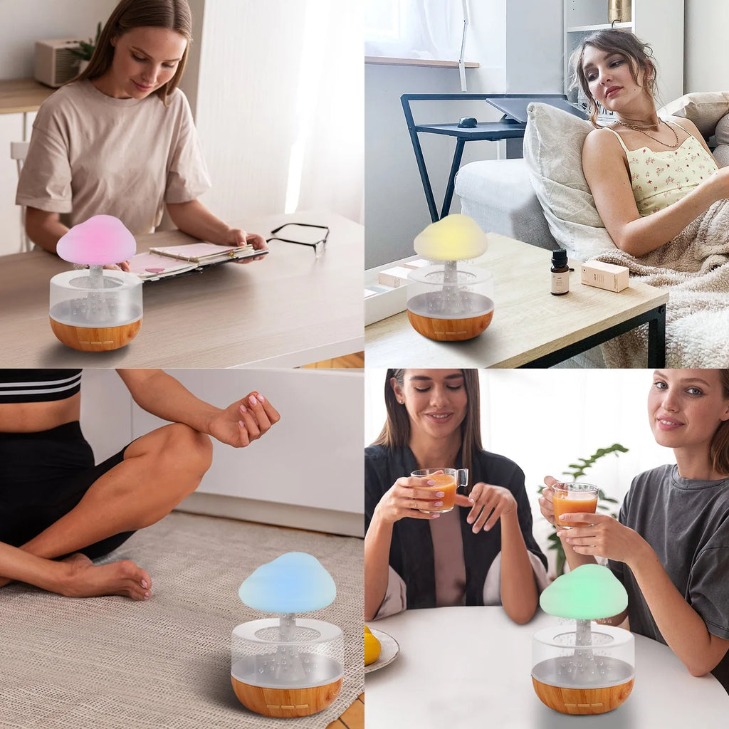 White cloud-shaped humidifier with multi-colour night light on a table.