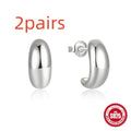 Sterling silver C-ring stud earrings with electroplated gold finish geometric design