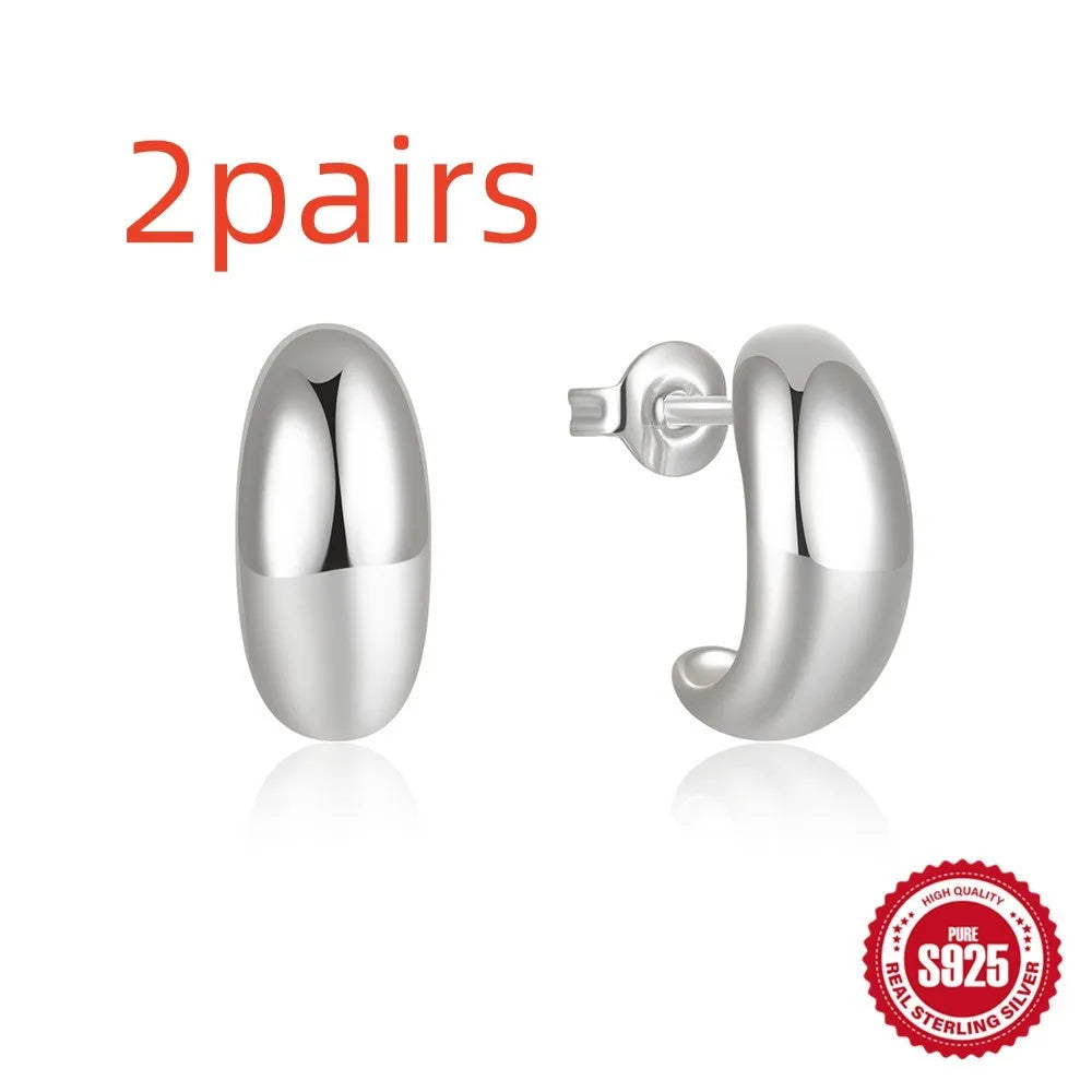 Sterling silver C-ring stud earrings with electroplated gold finish geometric design