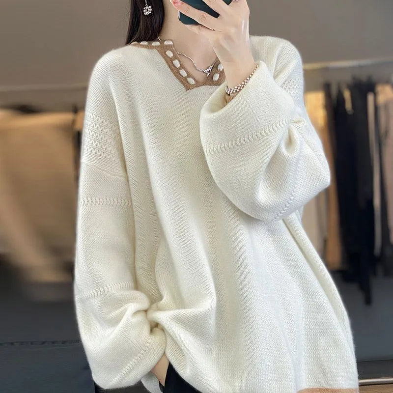 Women's camel coloured V-neck long sleeve pullover sweater on a hanger.