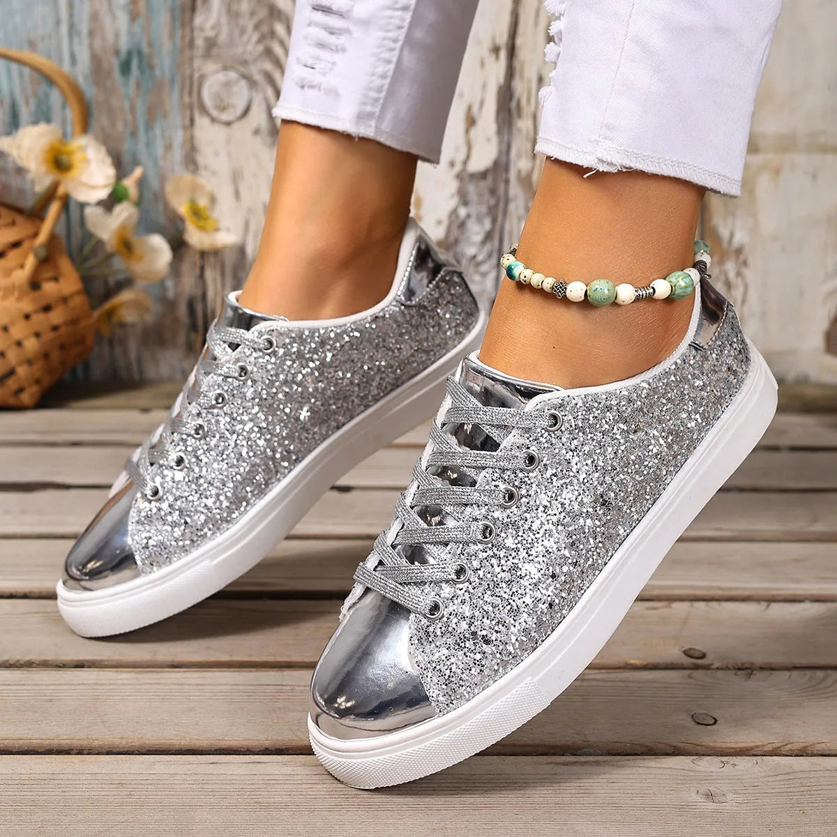 Women's plus size sequinned front lace-up board shoes in black, flat rubber sole.