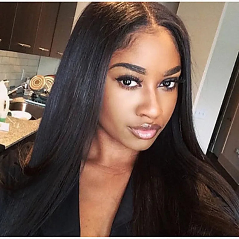 Long straight black synthetic wig with centre-parted bangs on a hair cover