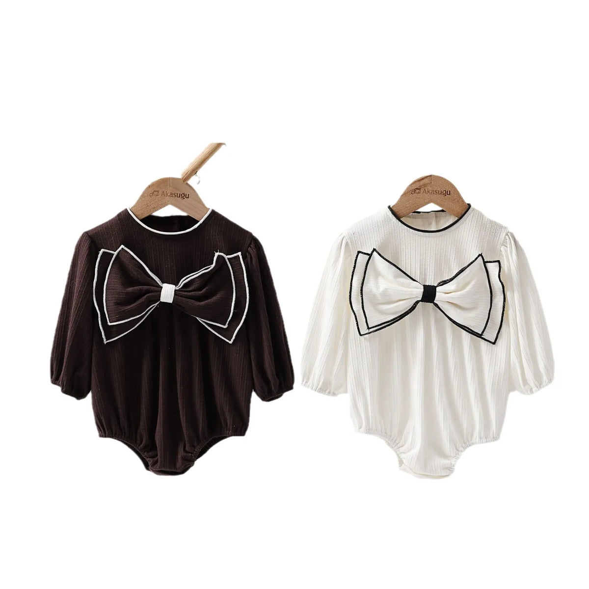 Cotton baby bow long sleeve onesie in black or white, triangle jumpsuit style, sizes 66-100cm