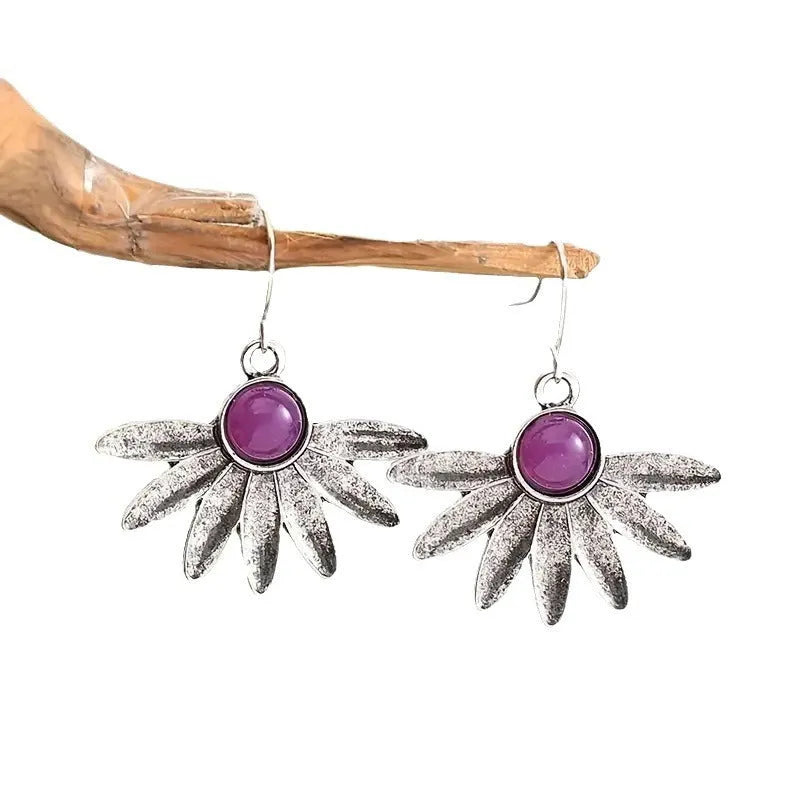 Purple Bohemian earrings with animal modelling and resin gemstone details on alloy framework
