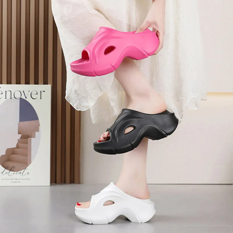 Women's thick-soled EVA beach slippers in rose red colour with round toe design.