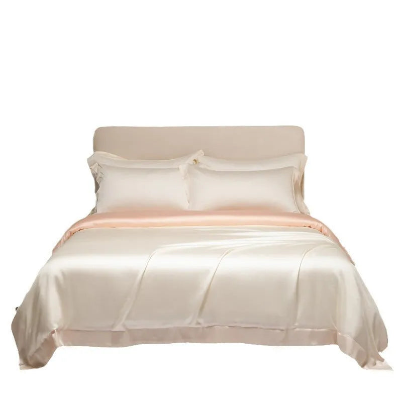 A modern Lenzing Tencel bedding set with a quilt cover and pillowcases in a neutral colour, laid flat on a bed.
