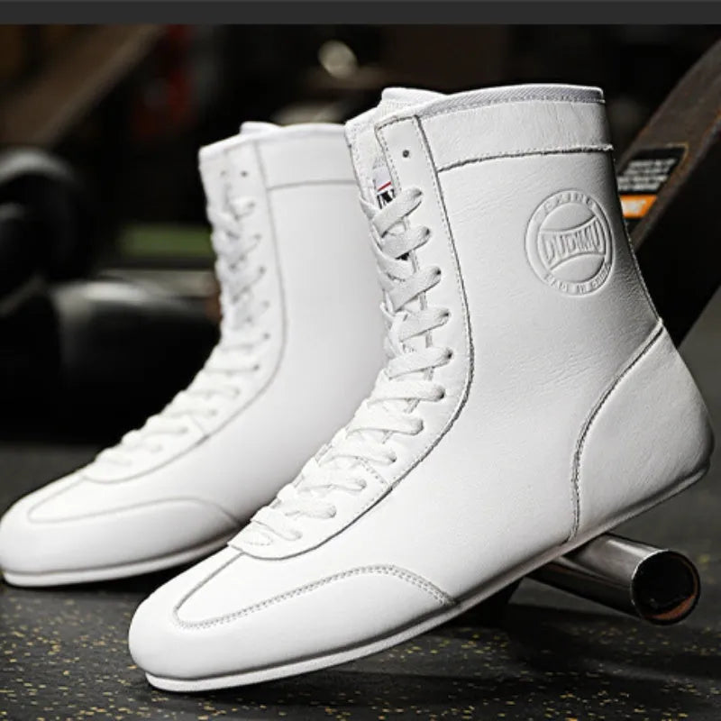 Professional black and gold mesh boxing shoes with non-slip soles for indoor training.