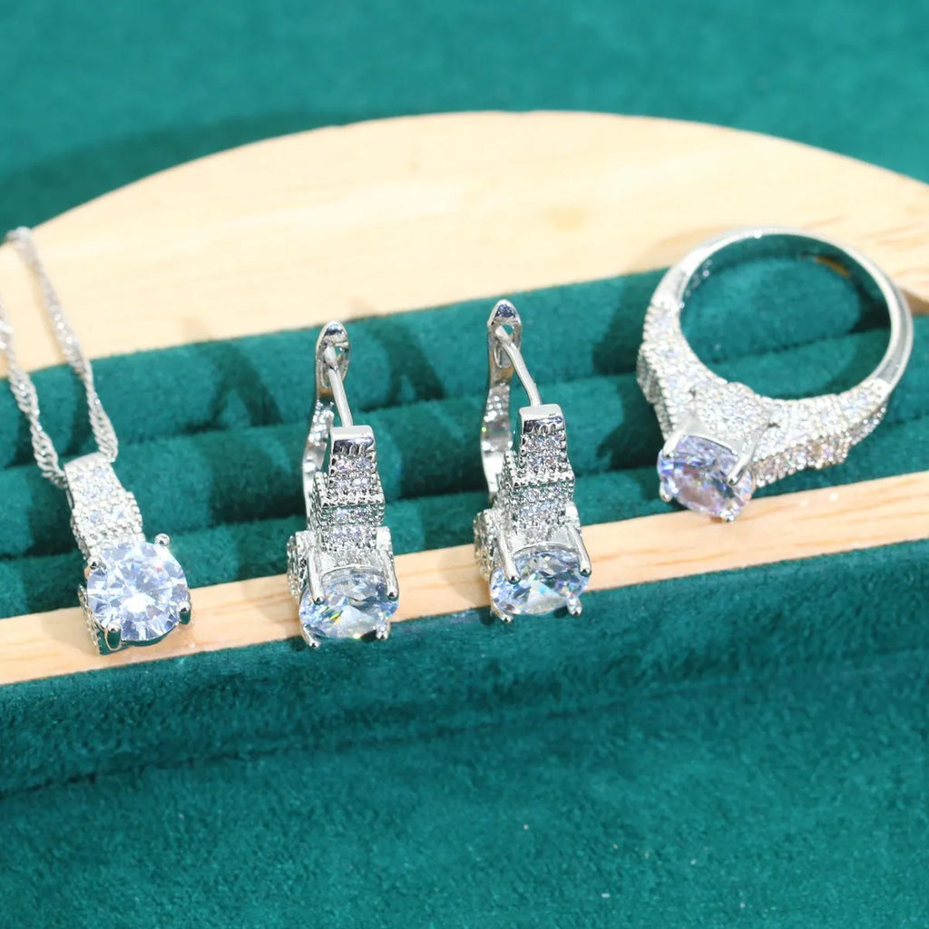 Four-piece bridal jewellery set with zircon chain necklace, bracelet, earrings and ring in alloy with water wave design