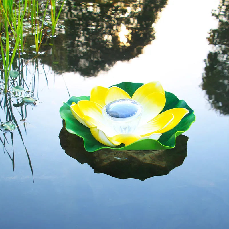 Floating solar lotus lamp on pond water with colourful LED light