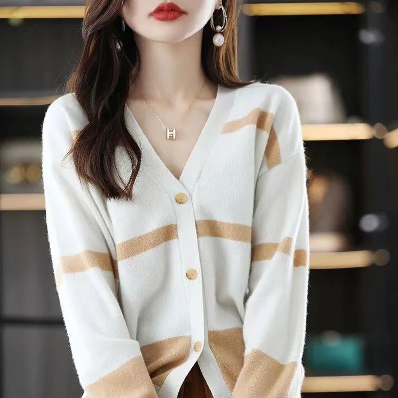Women's slim fit striped V-neck knitted cardigan in a 3D pattern on a hanger.