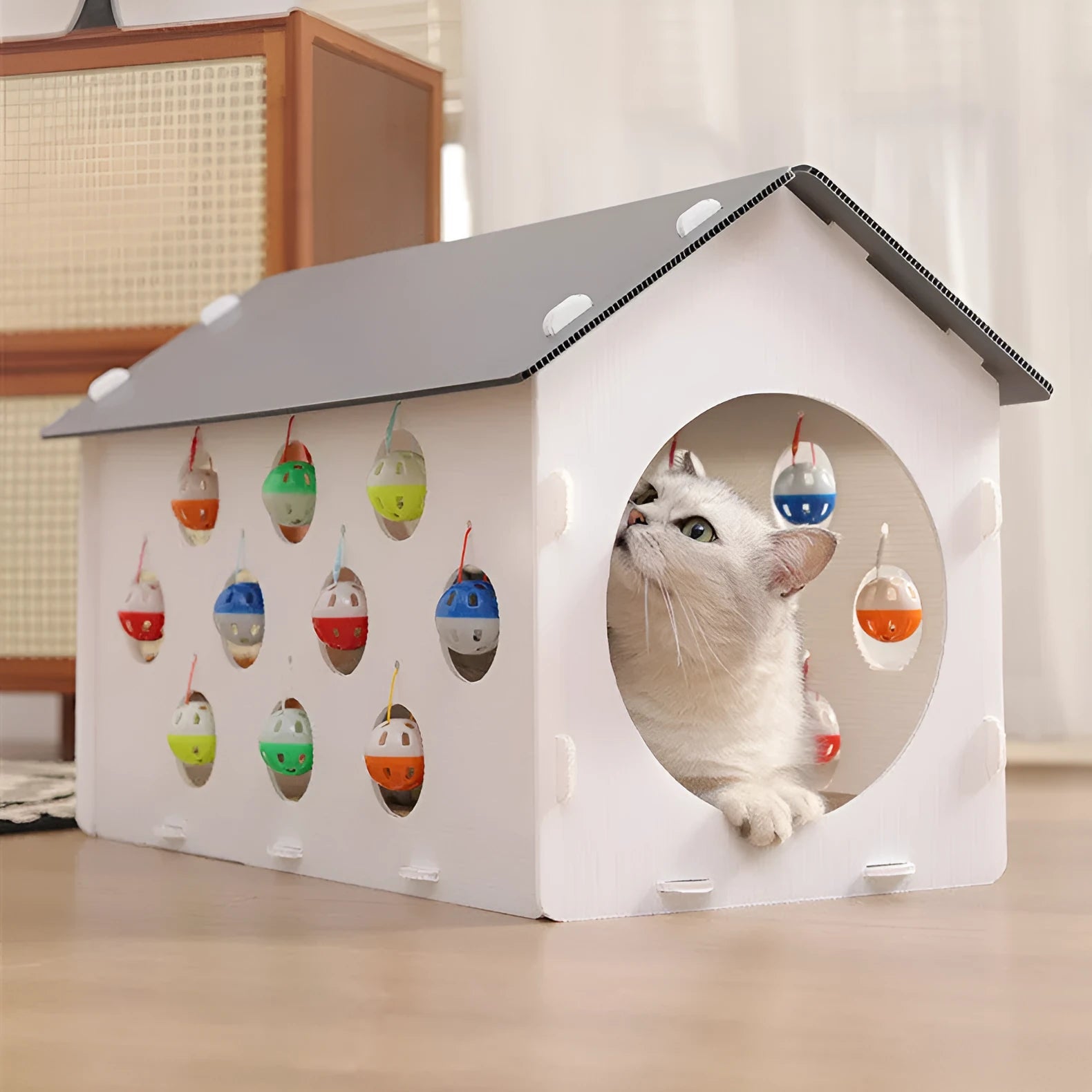 Plastic integrated cat scratch board, nest, and tunnel toy with a bell ball