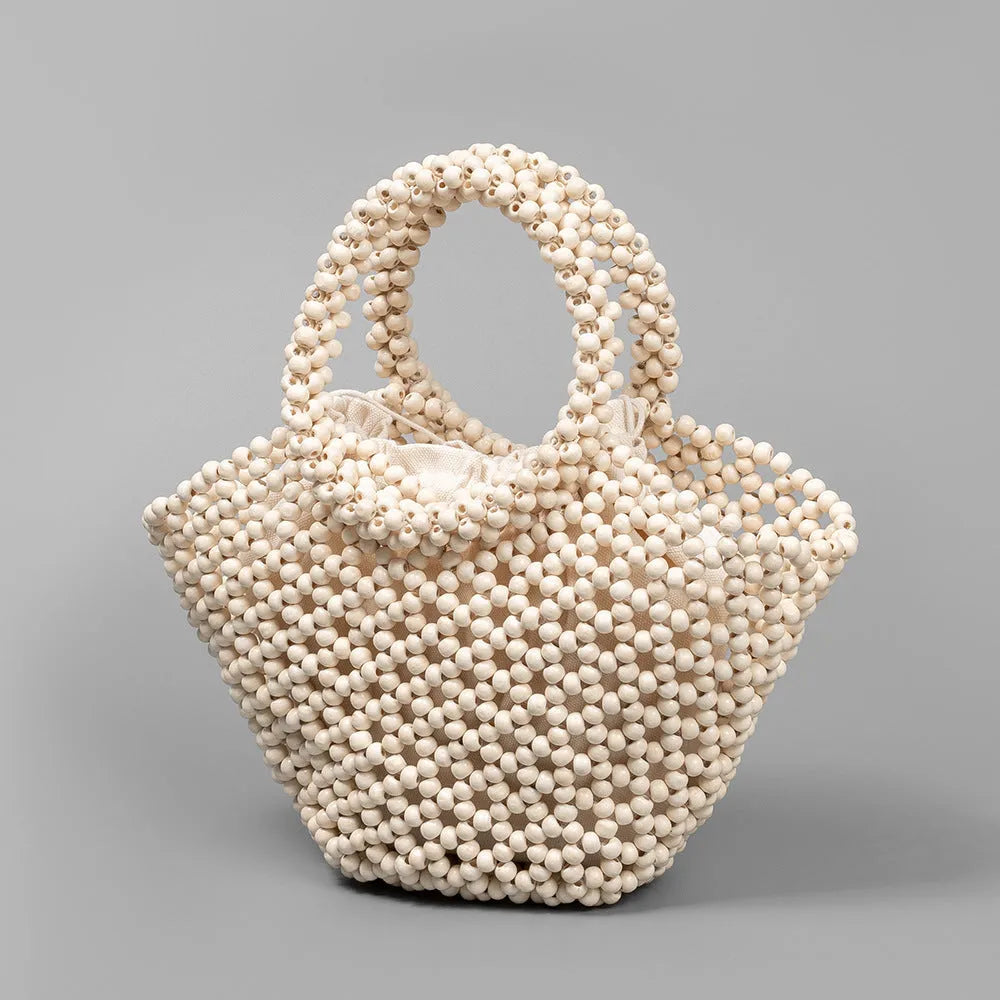 Hand-woven maple wood beach bag with wooden bead decoration in dumpling shape