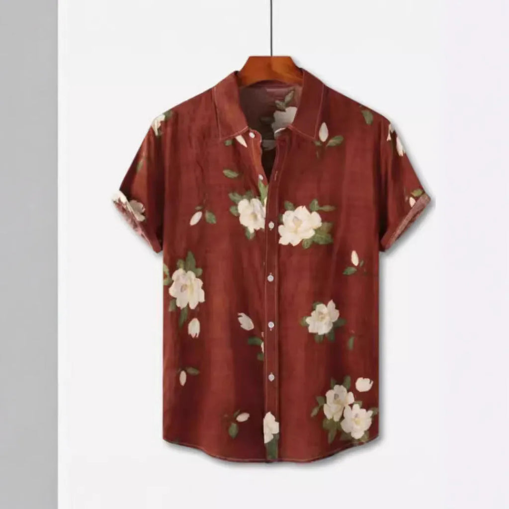 Hawaiian floral print short sleeve shirt with a lapel collar on a hanger.