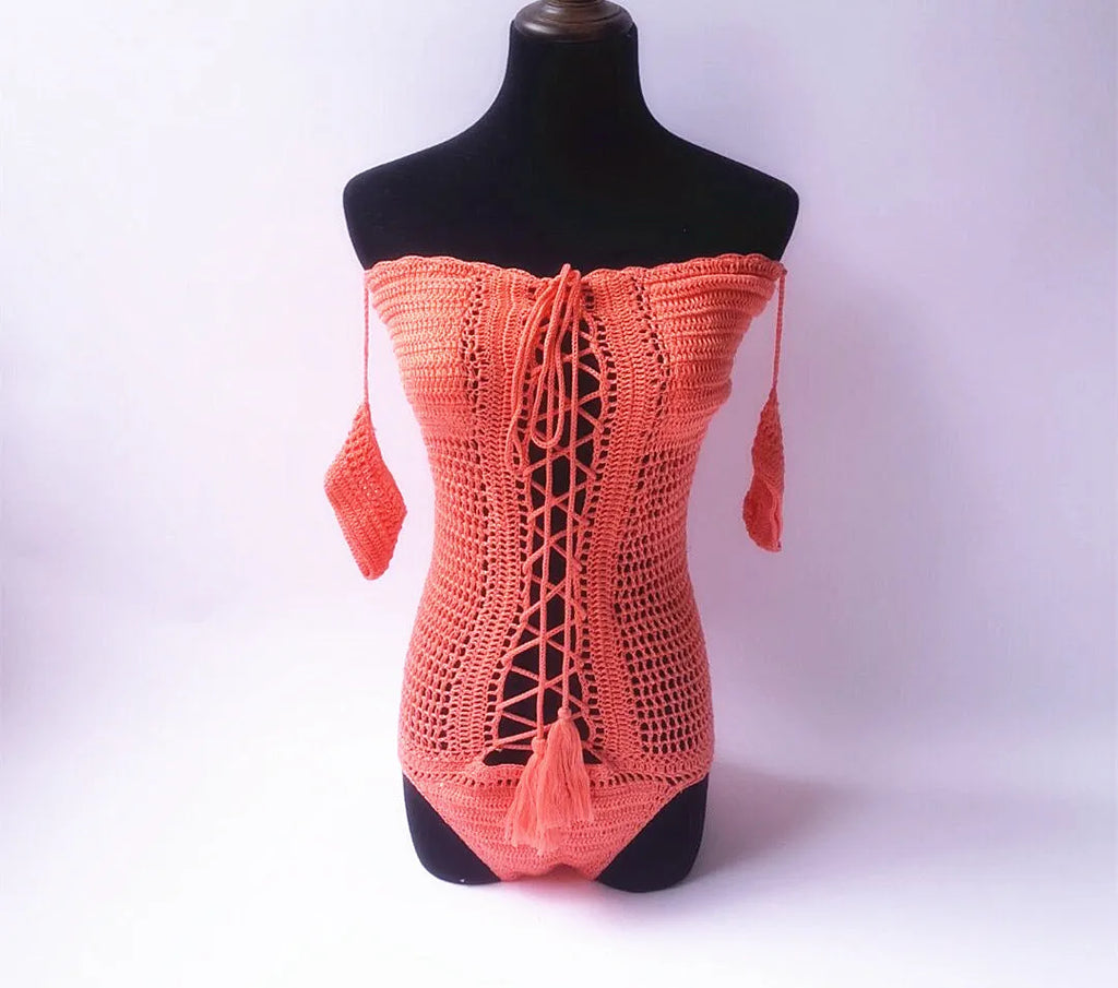 Women's off-the-shoulder strapless one-piece swimsuit on a mannequin.