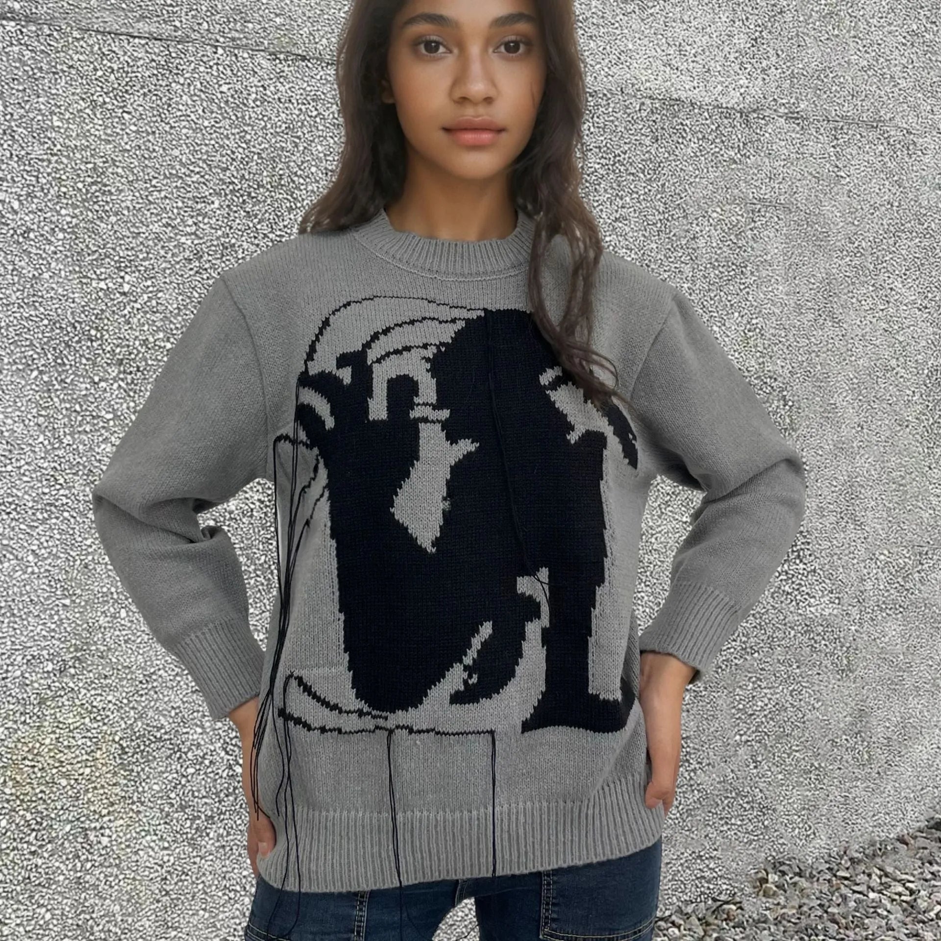 Women's loose grey alpaca wool pullover sweater with tassel detailing and round neck