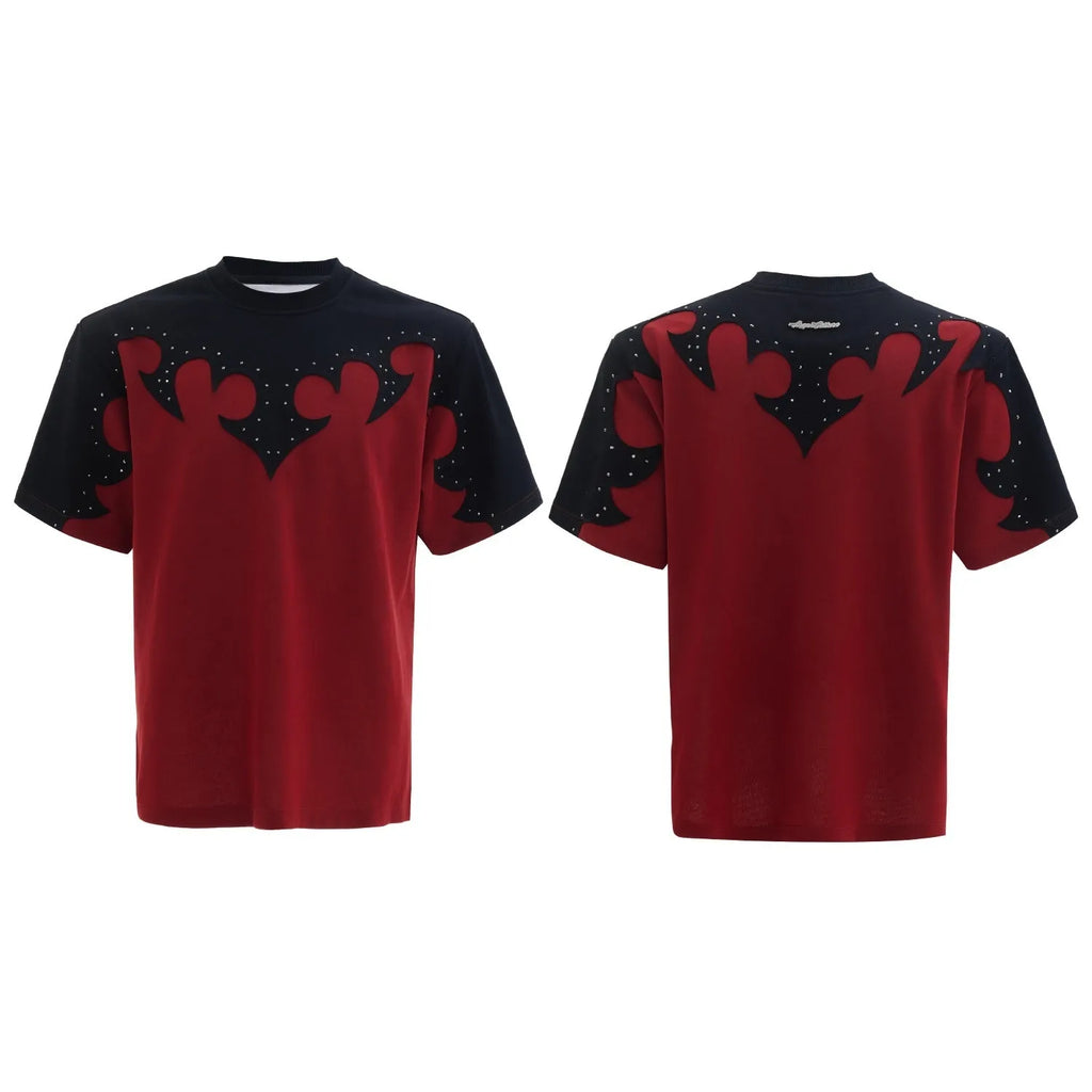 Men's grey cotton T-shirt with burnt flower stitching and rhinestone details on the front, showing loose fit and drop-shoulder sleeves.