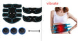Red edge electronic abdominal muscle toner patch with digital display on a grey background