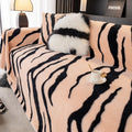 Zebra pattern flannel sofa cover with non-slip design in caramel colour showing texture and sizing
