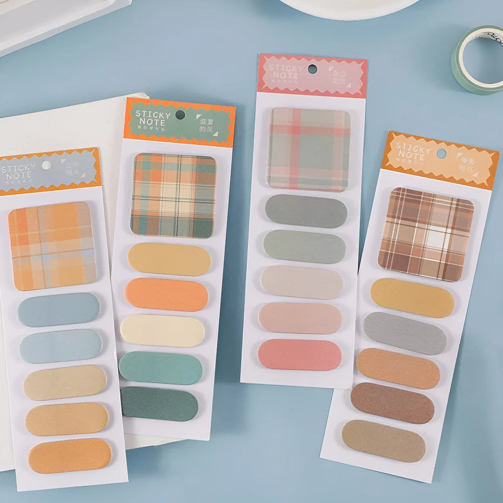 Colourful memo pad set showing six different sticky note designs with paper covers, each pad containing 20 sheets.