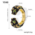 Women's geometric open ring with black electroplated cheetah drip pattern design, size 7