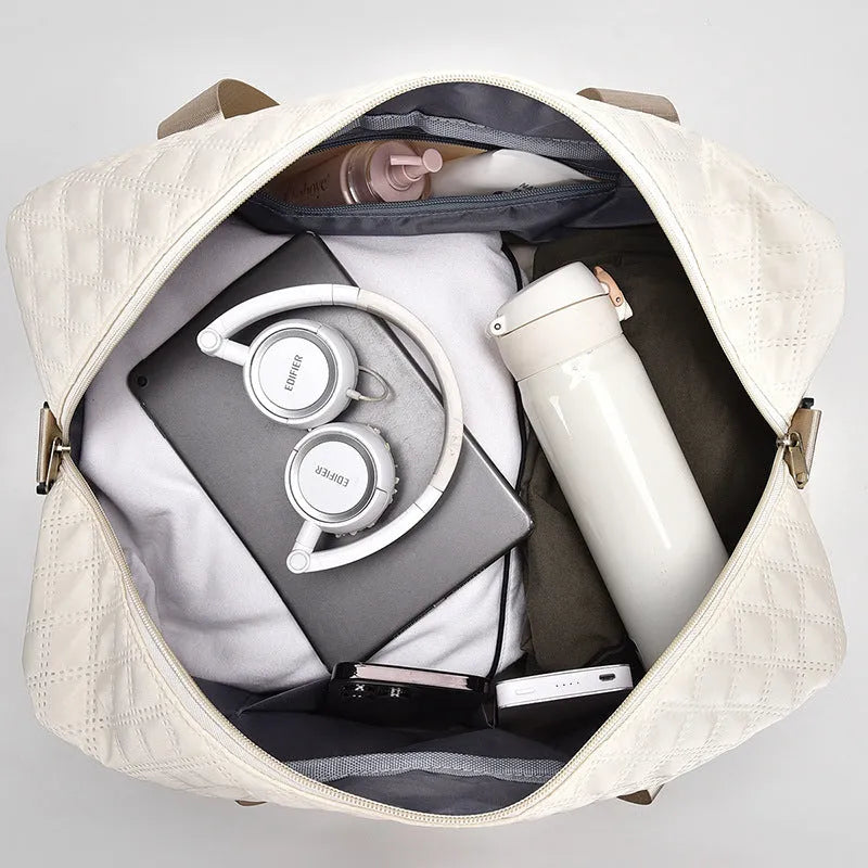 Large 55-litre buggy style travel bag in Oxford cloth, shown in a solid colour with shoulder straps.