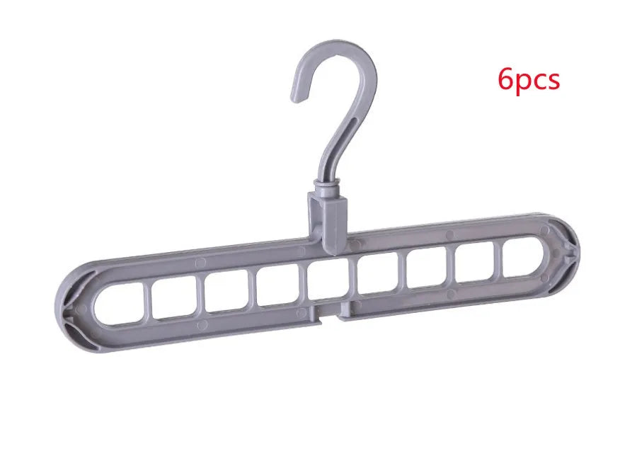 Plastic clothes hanger with a white hook on a pink background, showing its 33 cm length and rotatable handle.