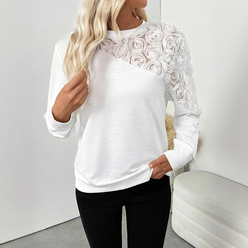 White women's long sleeve t-shirt with floral pattern, loose fit pullover style