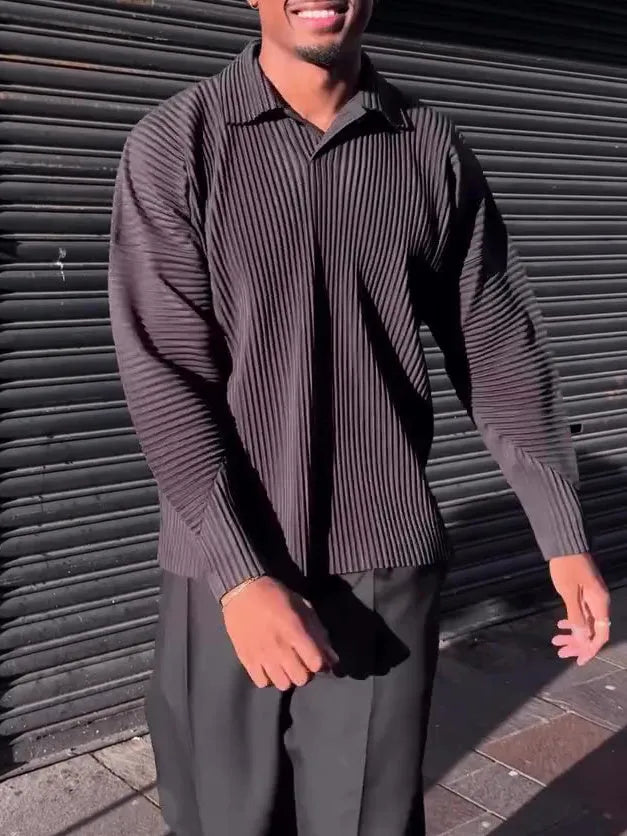 Black men's long-sleeved casual top with a pleated front detail, shown in a regular fit.