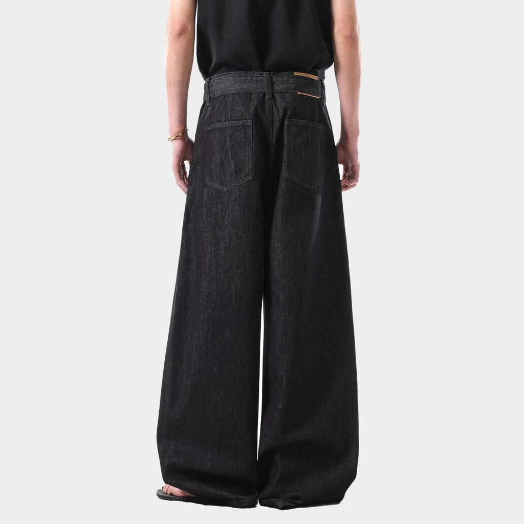 Black women's high waist straight leg jeans with gold detailing and a zip fly.