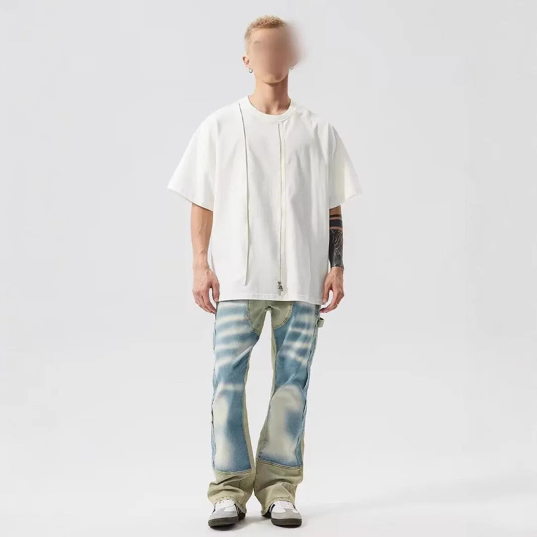 Yellow and blue retro patchwork jeans with splash-ink damaged design details on denim fabric