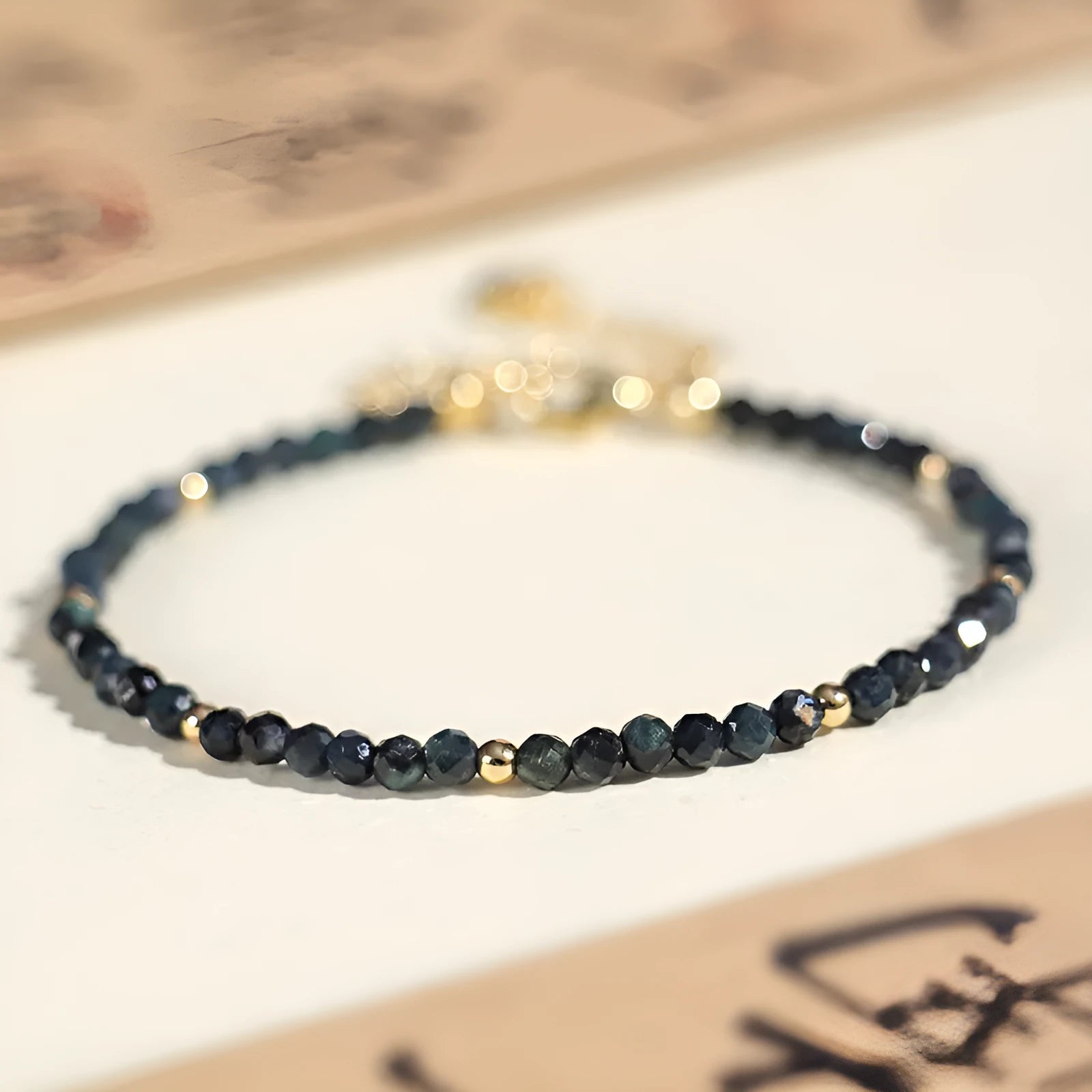 Blue tourmaline cut bead bracelet with 3mm faceted stones and spacer beads