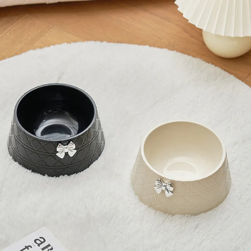 Pet food bowl with diamond pattern and a decorative bow design in a choice of colours.
