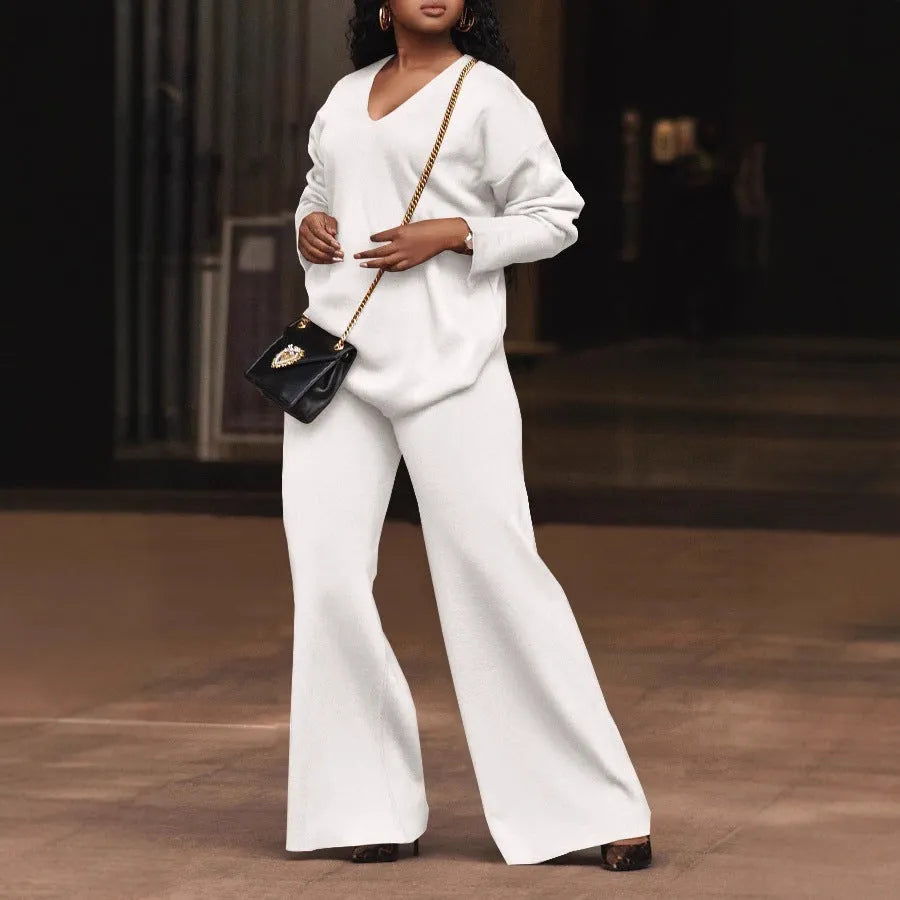 Women's brown thick suede two-piece suit with long sleeves and trousers, laid flat.