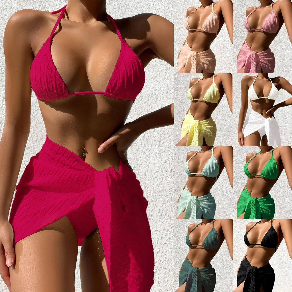 Women's halterneck backless bikini top with a matching mesh skirt in a solid colour.