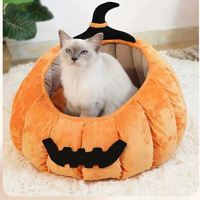 Orange Halloween pumpkin-shaped soft plush cat bed with a cartoon devil face design.