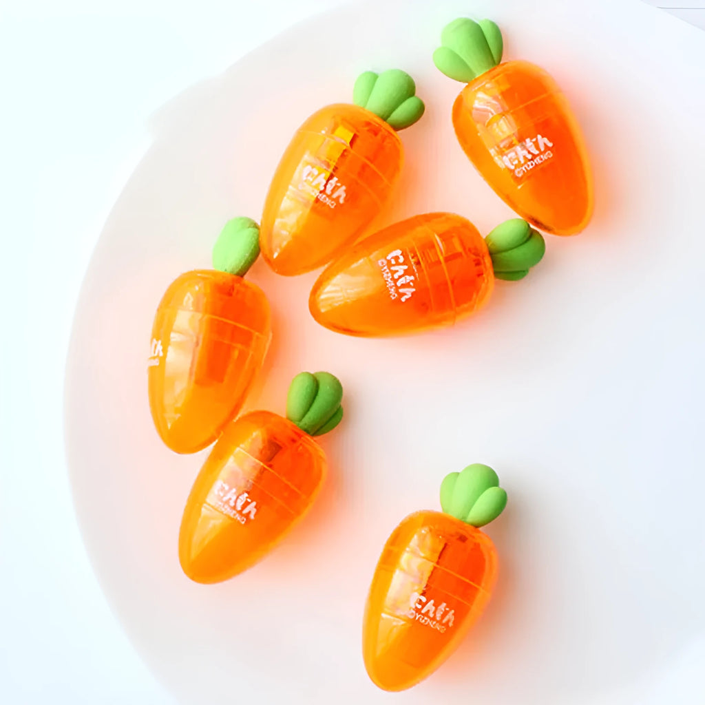 Orange plastic carrot cartoon pencil sharpener on a white background.